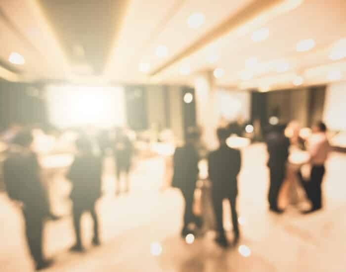 Blurred background of businesseople meet up in success party con