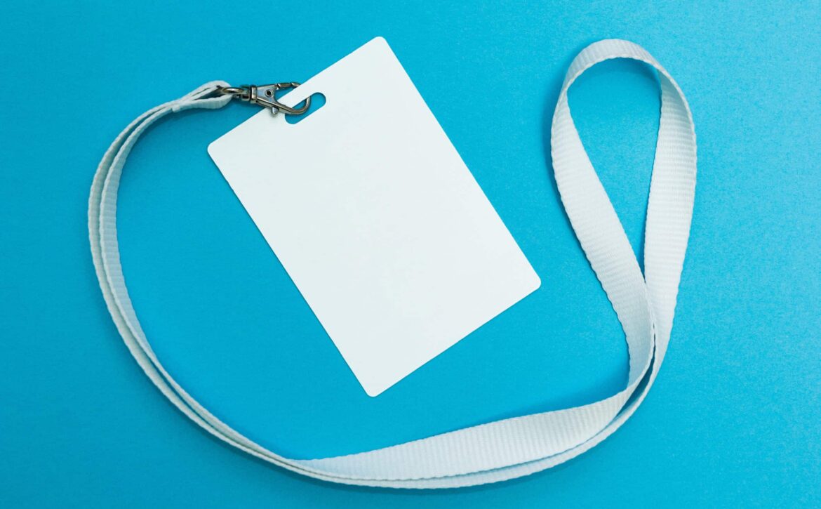 Blank badge or ID pass isolated on blue background, clipping pat