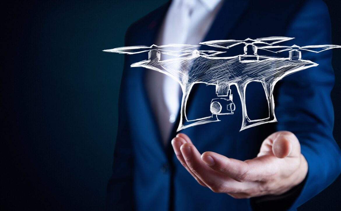 Businessman hold futuristic drone in hands